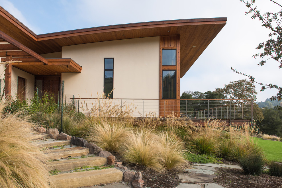 Photo of a large contemporary full sun hillside stone landscaping in San Francisco.