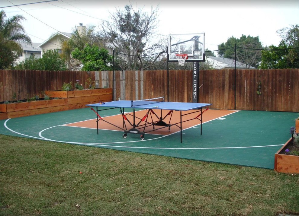 Design ideas for a large classic back full sun garden in Orange County with an outdoor sport court and a potted garden.