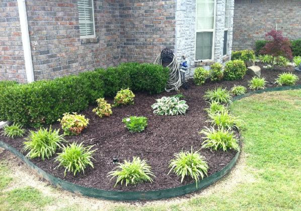 Design ideas for a mid-sized front yard mulch landscaping in Other.