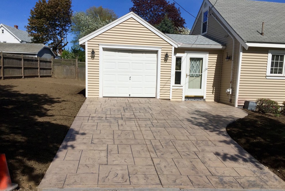 Photo of a mid-sized traditional full sun front yard concrete paver driveway in Boston.