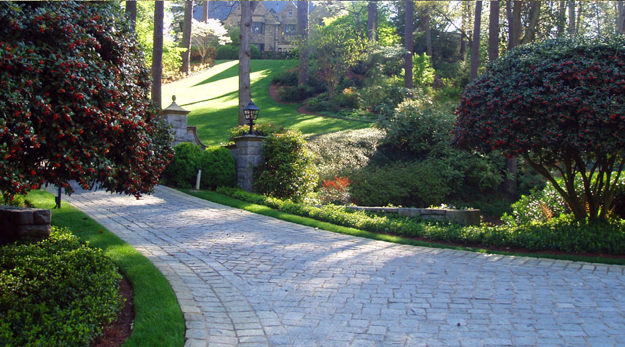 Photo of a medium sized traditional front driveway partial sun garden in Atlanta.