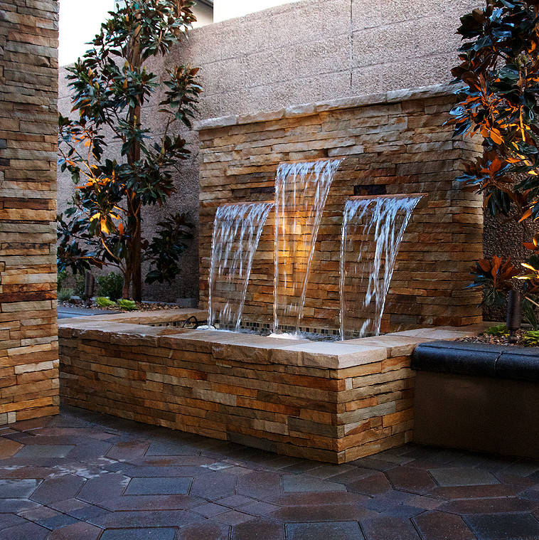Inspiration for a mid-sized traditional shade courtyard brick landscaping in Orange County.