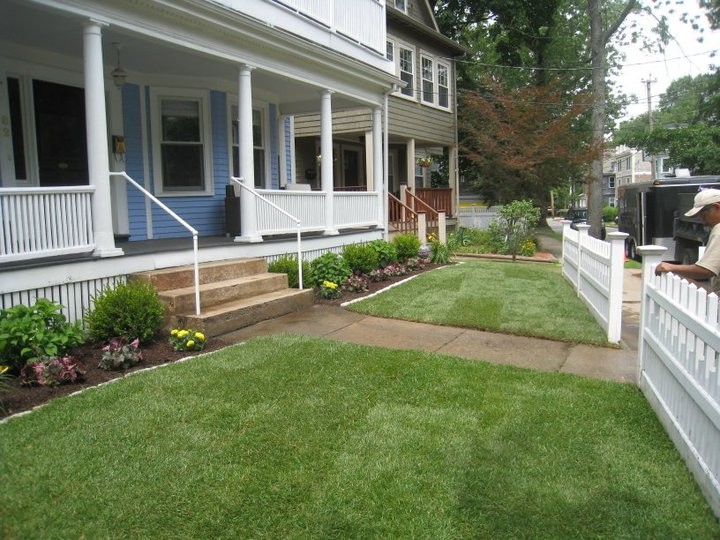 Inspiration for a large traditional backyard landscaping in Boston.