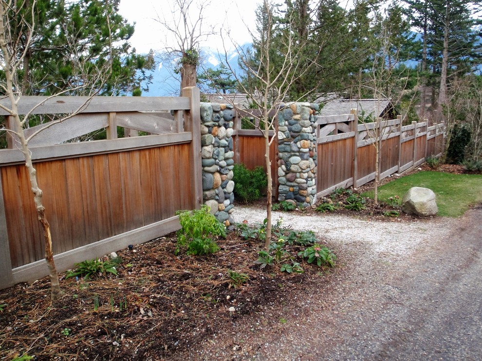 Inspiration for a medium sized classic back full sun garden in Vancouver with a garden path and gravel.