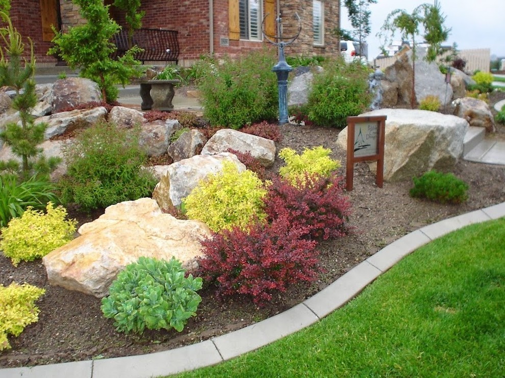 This is an example of a mid-sized drought-tolerant front yard mulch landscaping in Salt Lake City.