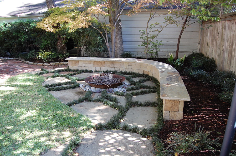 Design ideas for a large traditional backyard concrete paver landscaping in Dallas.