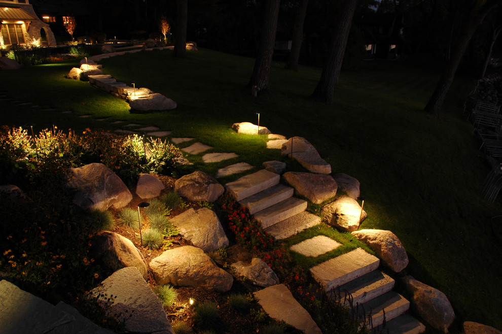 This is an example of a medium sized classic back formal partial sun garden for spring in Minneapolis with a garden path and natural stone paving.
