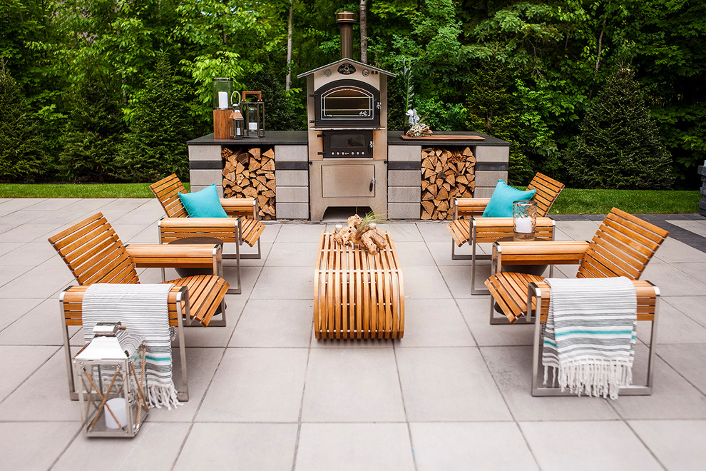 Inspiration for a large transitional backyard concrete paver patio remodel in Toronto