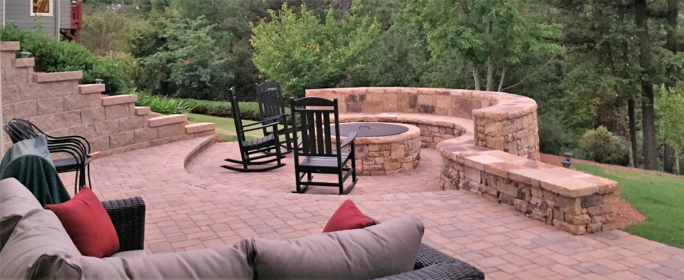 Inspiration for a medium sized traditional back patio in Atlanta with a fire feature and natural stone paving.