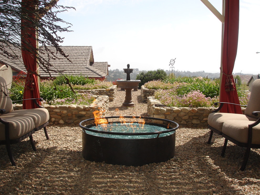 Photo of a mediterranean garden in San Luis Obispo with a fire feature.