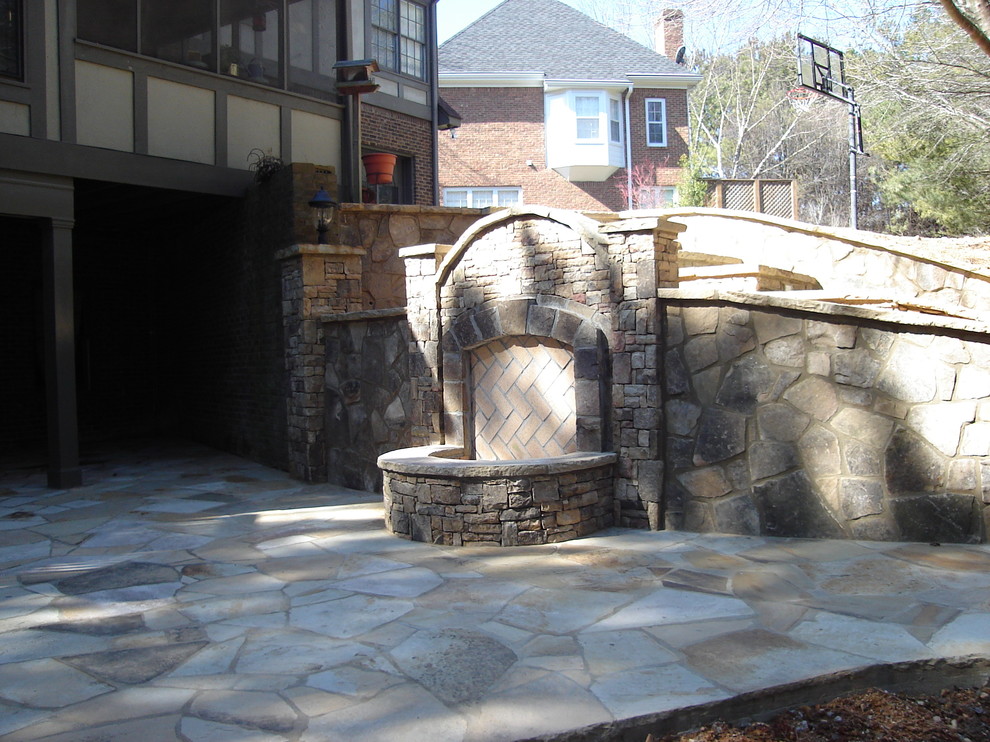Outdoor Fireplace and Flagstone Patio Traditional Landscape