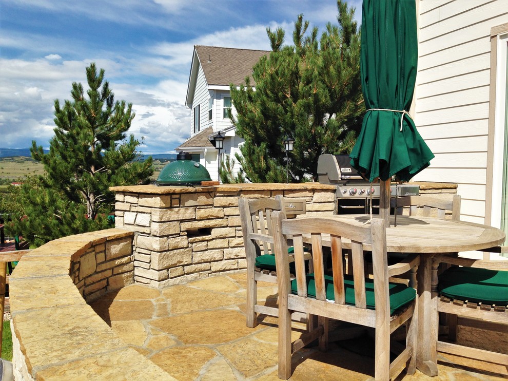 Inspiration for a medium sized contemporary back garden in Denver with natural stone paving.