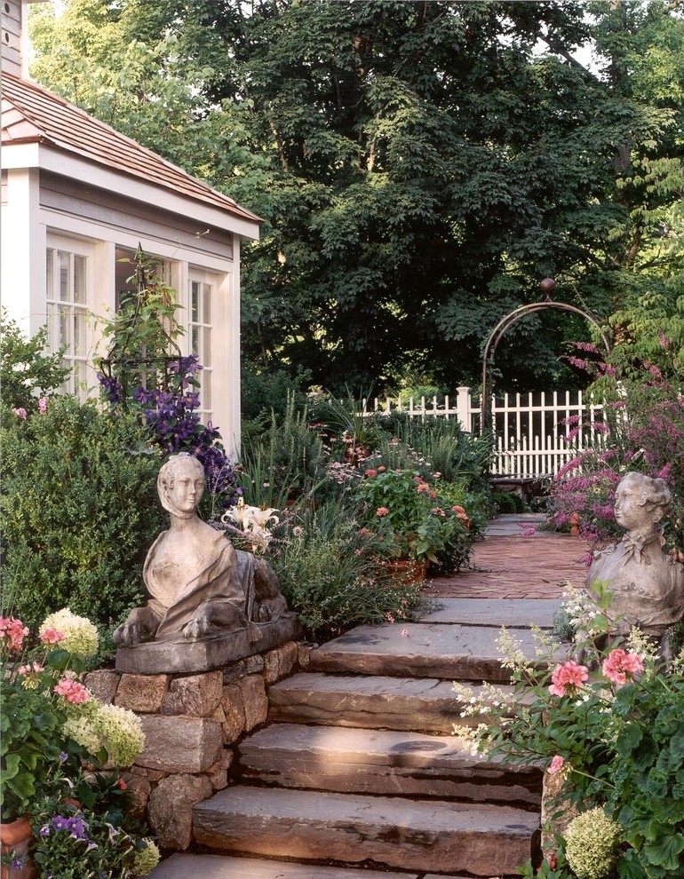 Design ideas for a traditional full sun garden in New York with a garden path and natural stone paving.