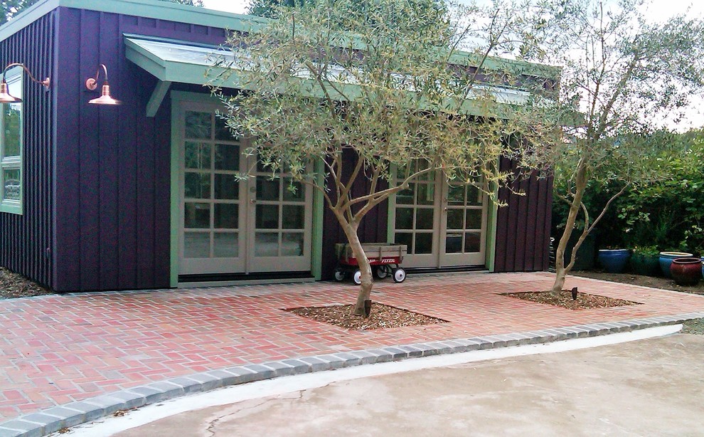 This is an example of a small modern full sun front yard brick driveway in San Francisco.