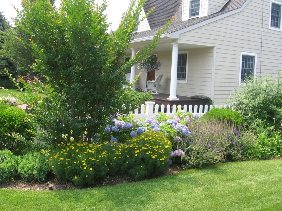 This is an example of a classic side garden in New York with a garden path and natural stone paving.