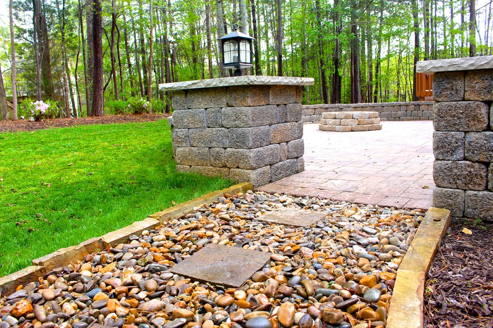 Inspiration for a medium sized traditional back partial sun garden for summer in Atlanta with a retaining wall and concrete paving.