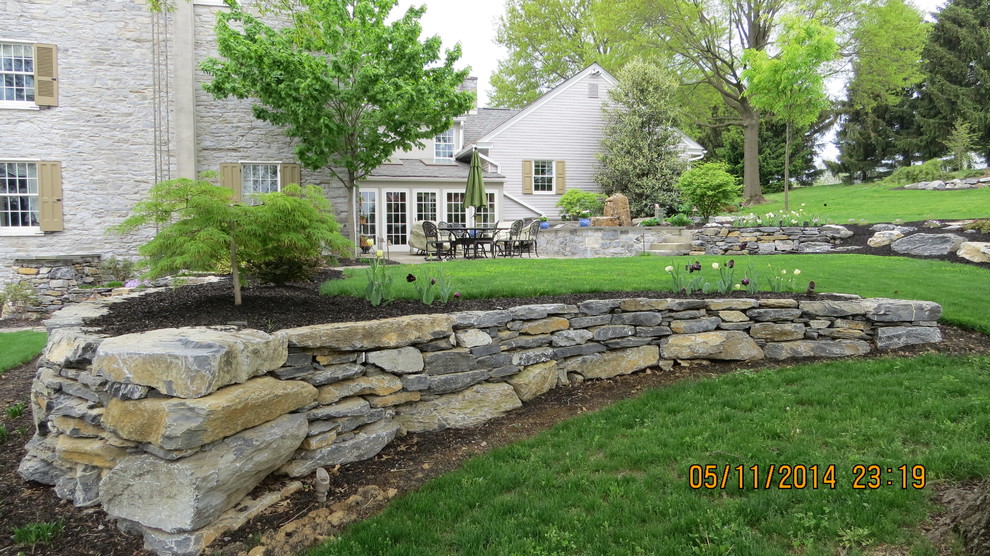 This is an example of a farmhouse landscaping in Other.