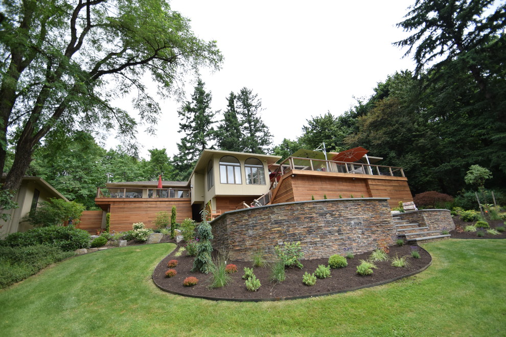Inspiration for a large contemporary full sun backyard mulch landscaping in Portland for summer.