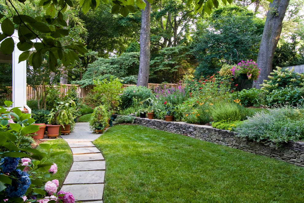 Inspiration for a large traditional back partial sun garden for summer in DC Metro with natural stone paving.