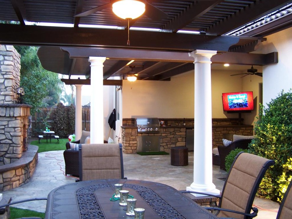 Inspiration for a medium sized mediterranean back patio in Other with a fire feature and natural stone paving.