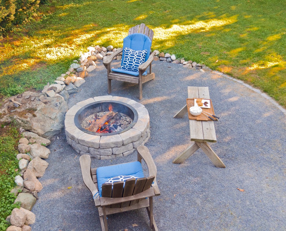 Small beach style backyard patio photo in Boston with a fire pit
