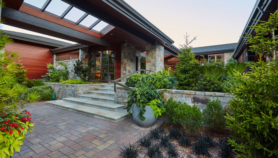 Photo of a large contemporary back driveway garden in Portland with a garden path.
