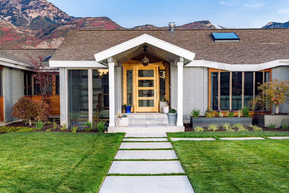 Photo of a contemporary full sun front yard concrete paver landscaping in Salt Lake City.