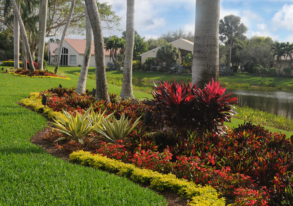 Medium sized world-inspired partial sun garden in Miami.