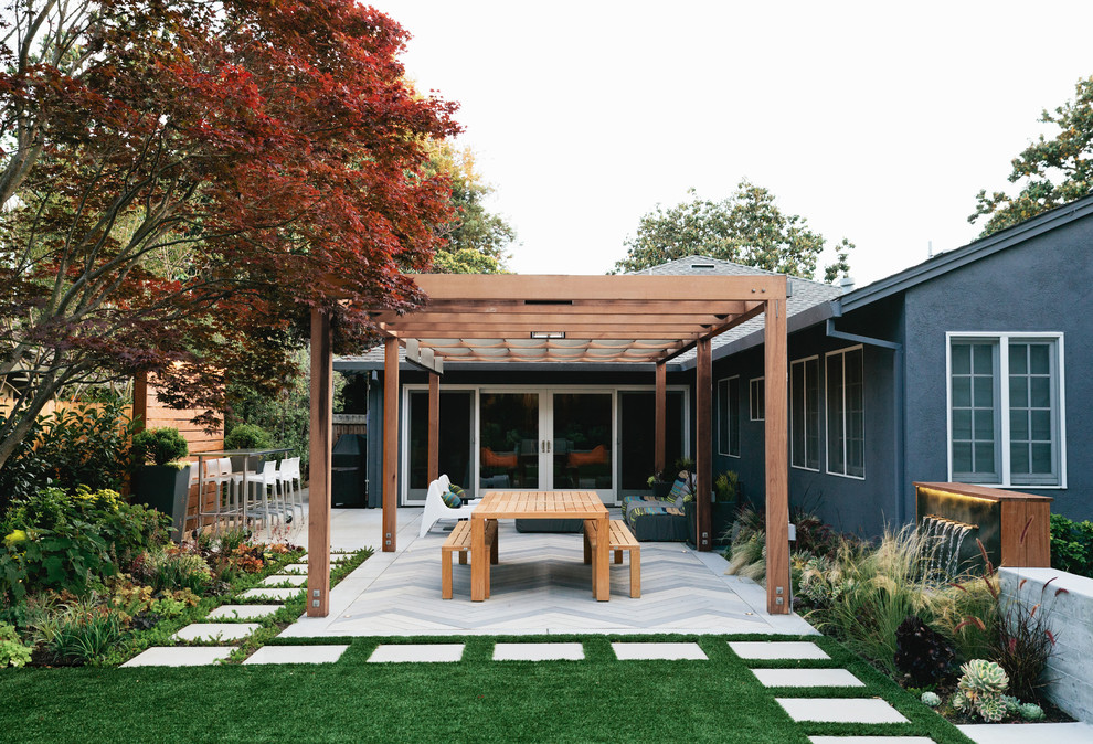 Photo of a medium sized modern back garden in San Francisco with concrete paving and an outdoor sport court.