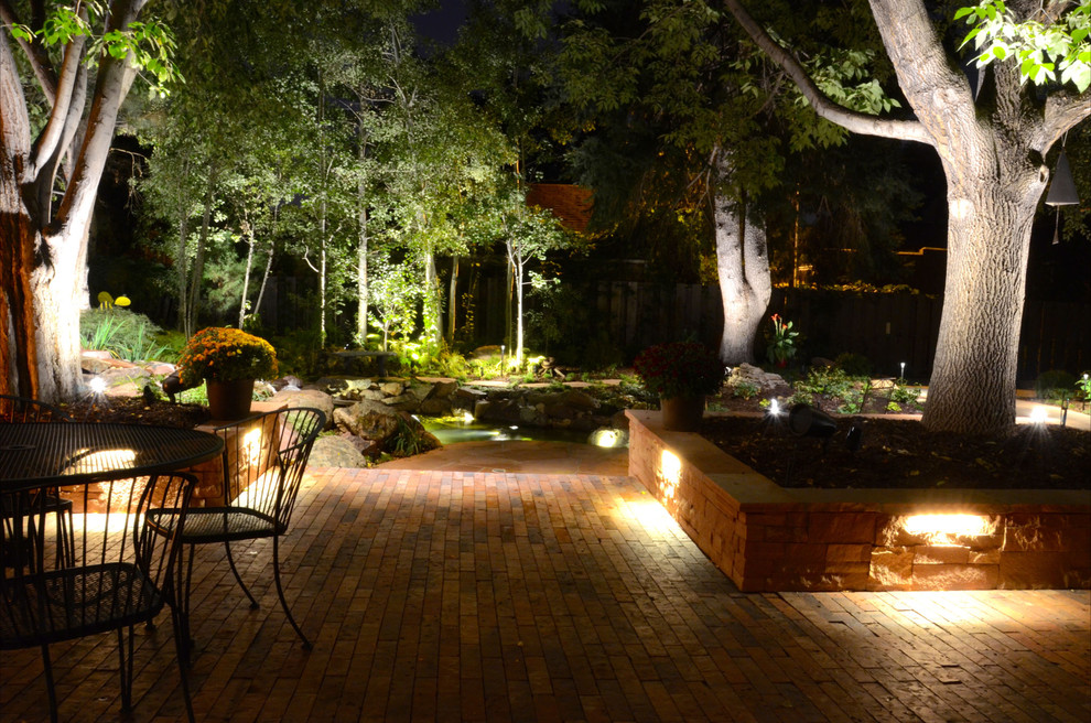 Photo of a classic back garden in Denver with an outdoor sport court and brick paving.