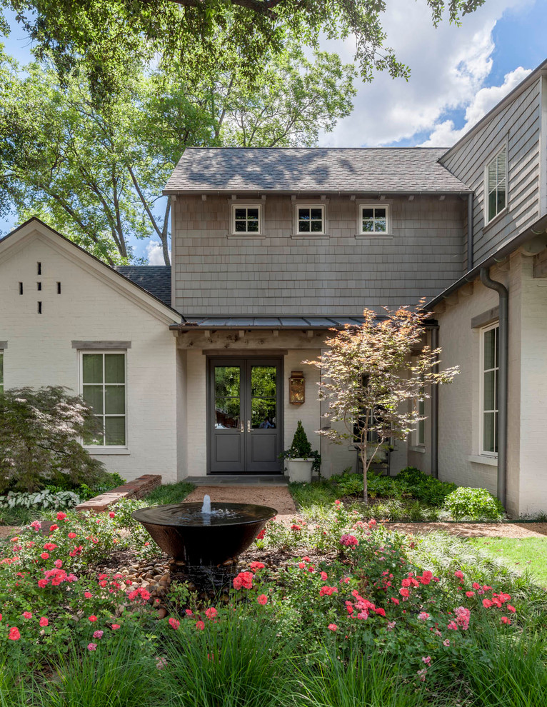 Design ideas for a traditional water fountain landscape in Dallas.