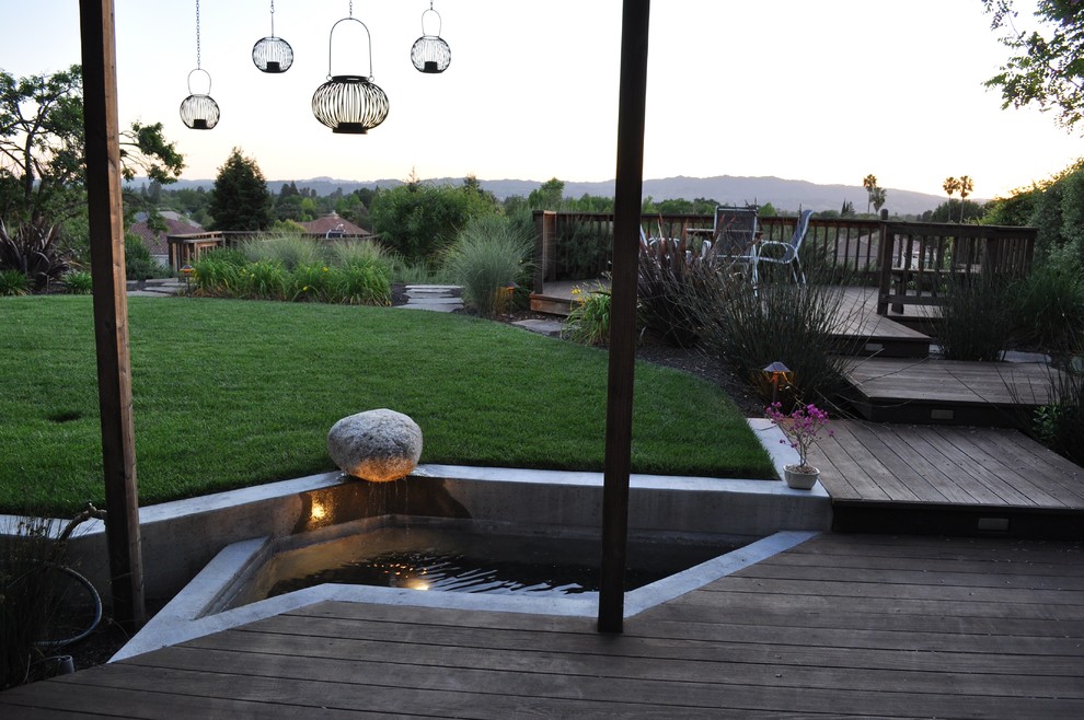 Inspiration for a contemporary raised pond in San Francisco with a water feature.