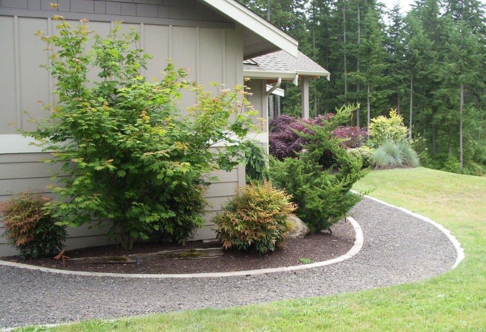 This is an example of a mid-sized craftsman partial sun side yard landscaping in Seattle.