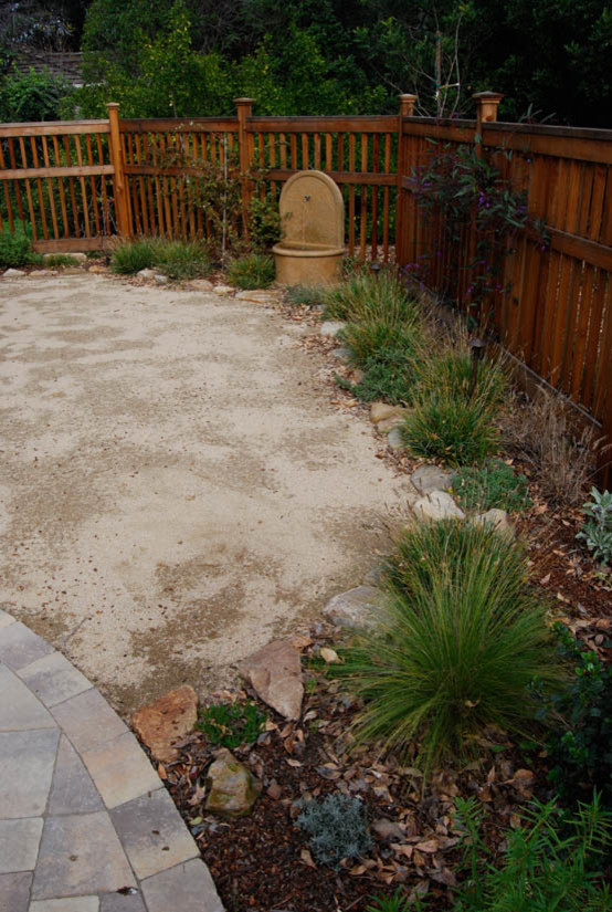 This is an example of a mid-sized mediterranean drought-tolerant and partial sun backyard brick garden path in San Francisco.