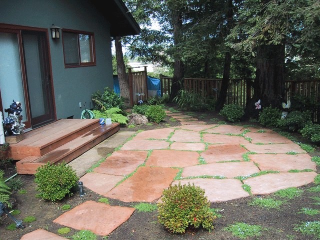 Inspiration for a large traditional full sun side yard stone landscaping in San Francisco.