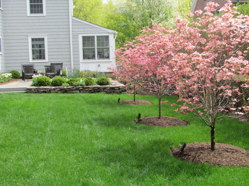 This is an example of a mid-sized farmhouse backyard landscaping in Philadelphia.