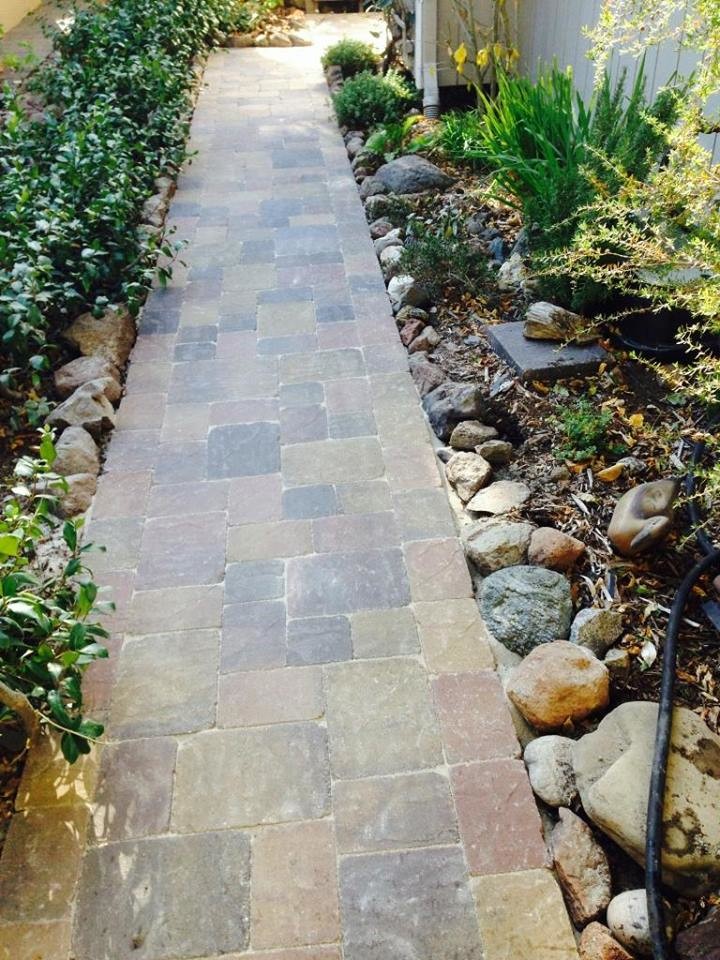 This is an example of a large rustic concrete paver driveway in San Francisco.