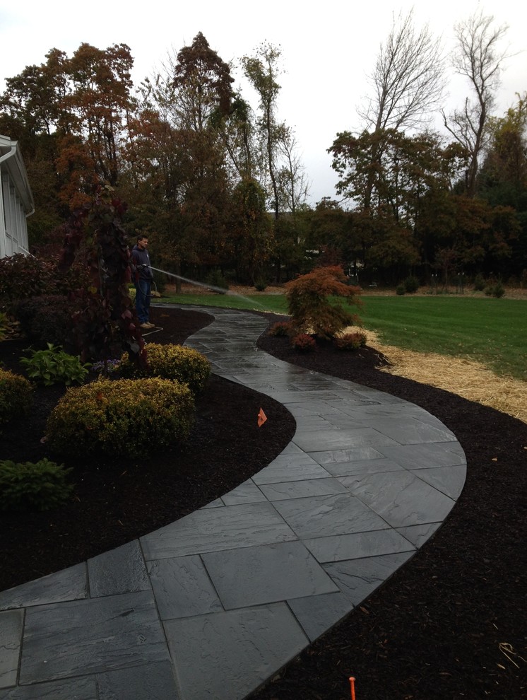 Design ideas for a large contemporary concrete paver landscaping in New York.