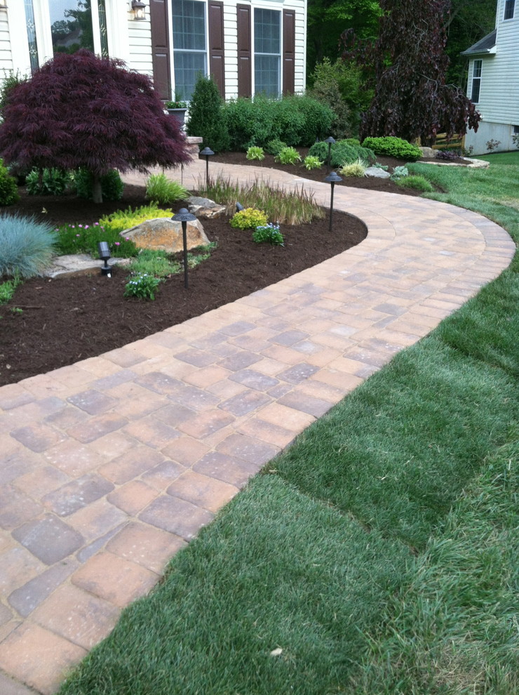 Photo of a mid-sized rustic front yard brick garden path in Wilmington.