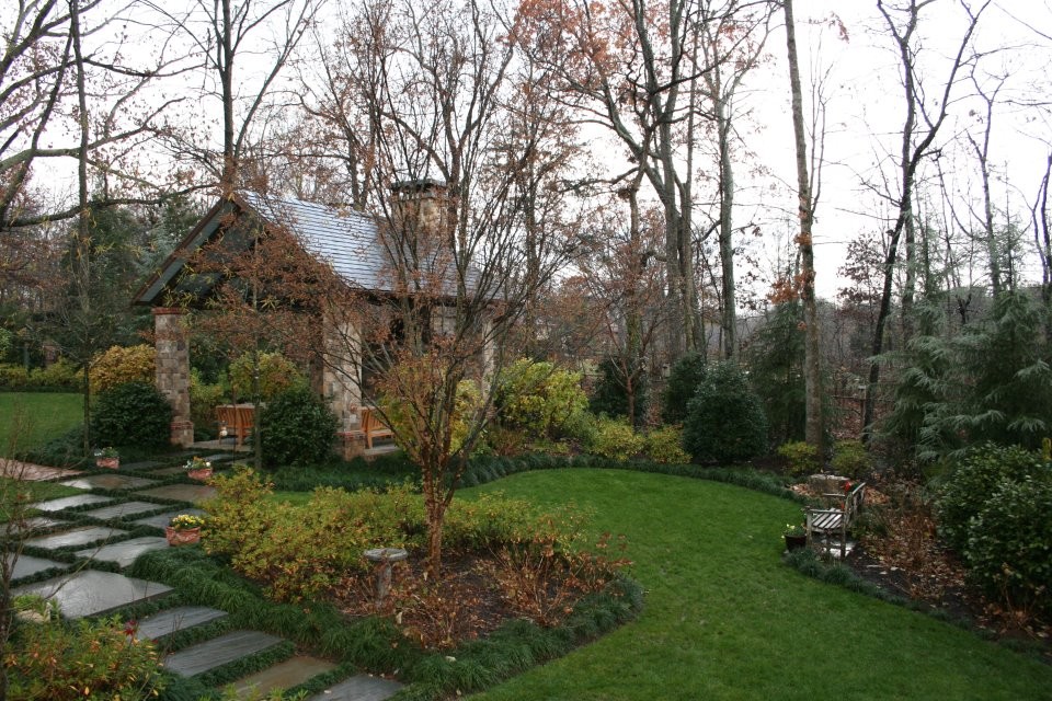 Design ideas for a large traditional shade backyard brick garden path in Other.