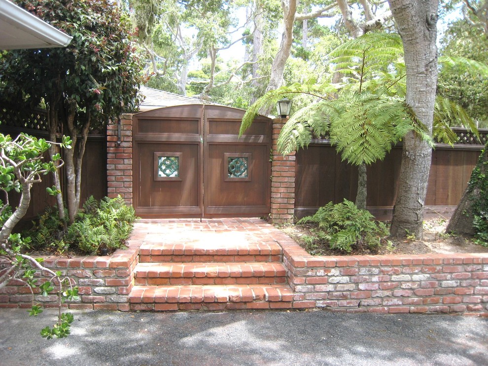 Photo of a large traditional front garden in Sacramento with a garden path and brick paving.