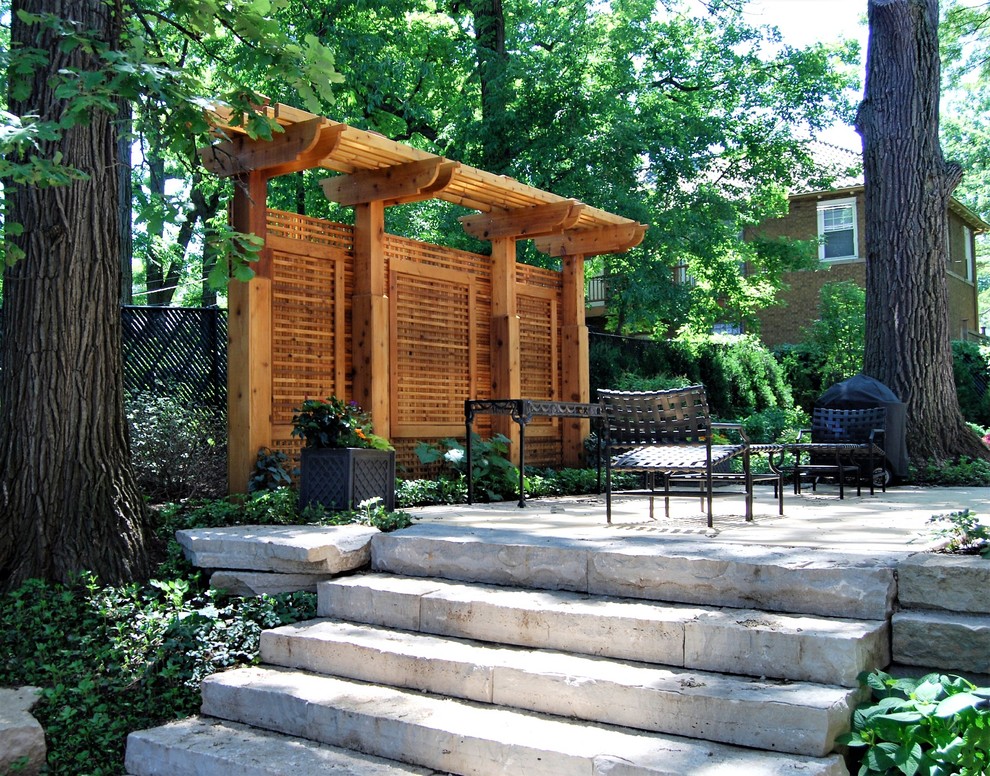Inspiration for a mid-sized rustic partial sun backyard brick landscaping in Chicago for summer.