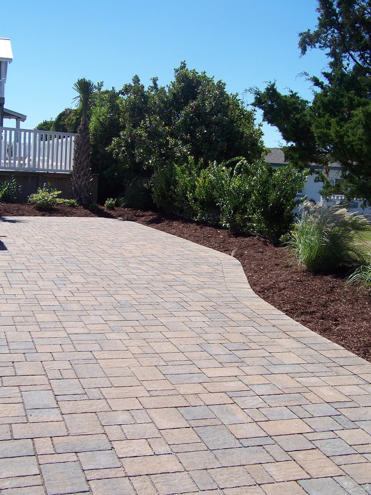 Design ideas for a coastal full sun backyard concrete paver landscaping in Other.