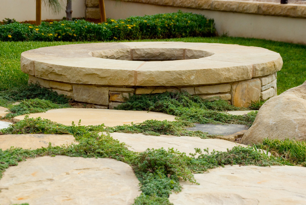Design ideas for a small traditional full sun backyard stone landscaping in Santa Barbara for summer.