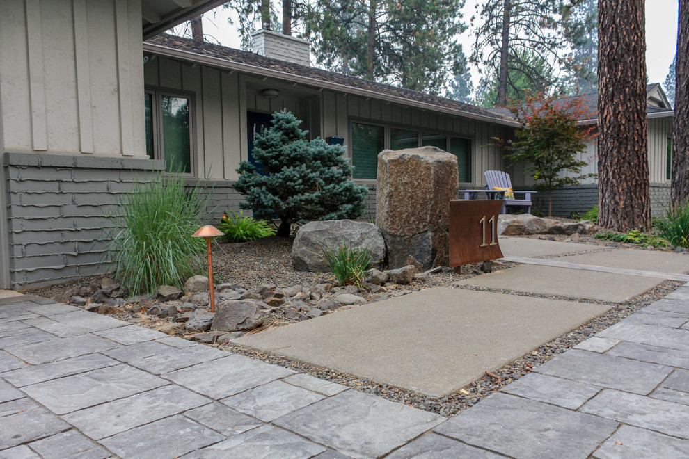 Design ideas for a large mid-century modern front yard concrete paver landscaping in Seattle.