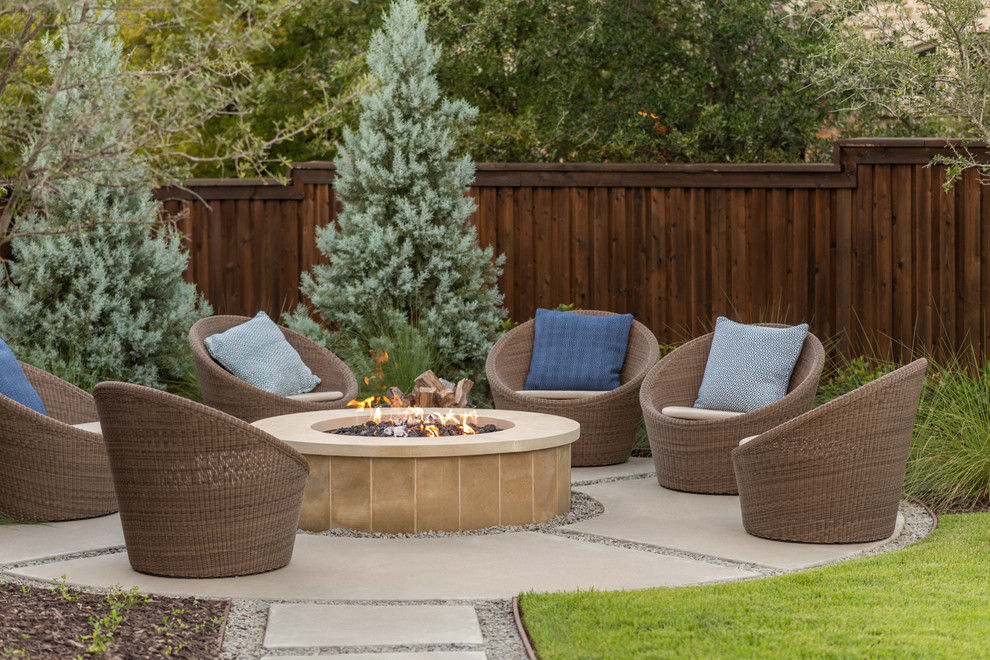 Example of a large transitional backyard patio design in Dallas with a fire pit