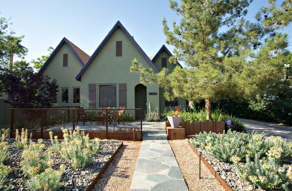 Design ideas for a medium sized urban front xeriscape partial sun garden for spring in Phoenix with natural stone paving.