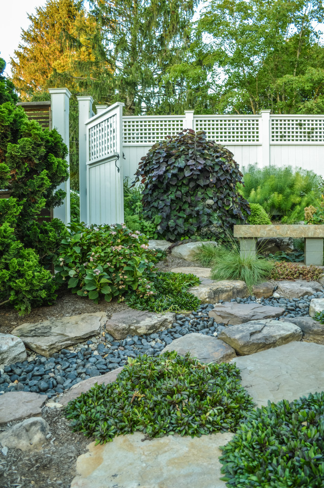 Photo of a small traditional privacy and partial sun side yard stone formal garden in Baltimore for spring.