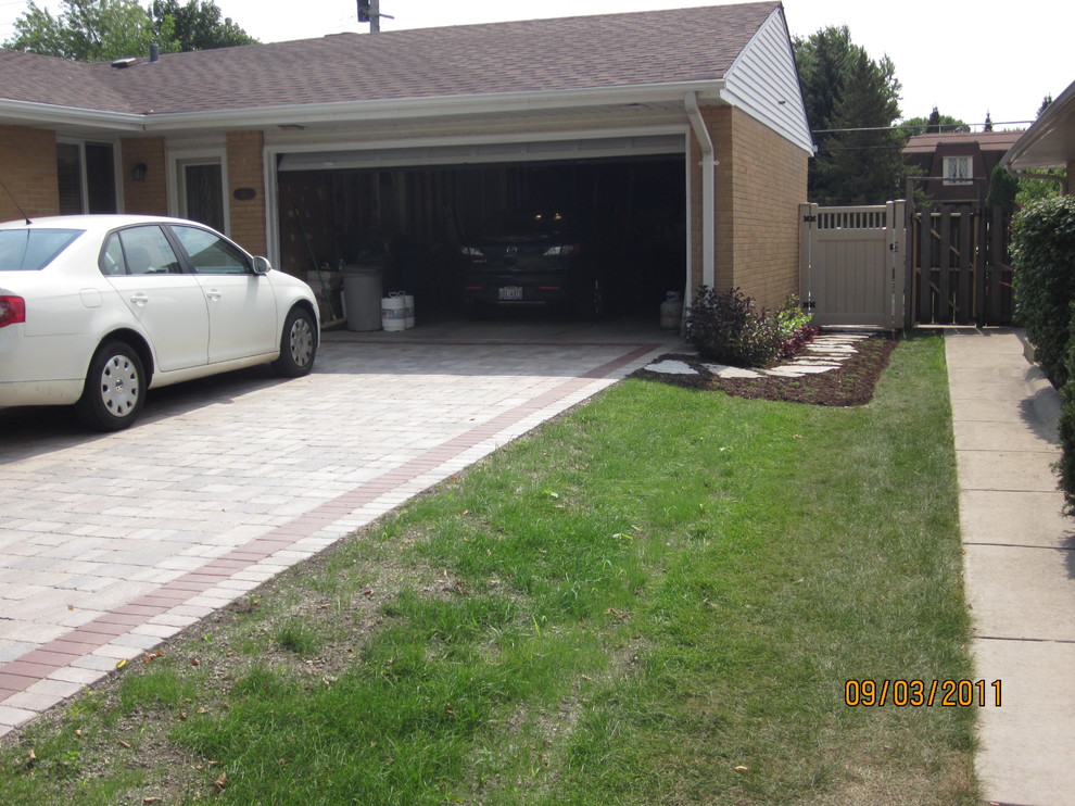 Contemporary front driveway partial sun garden for summer in Chicago with concrete paving.