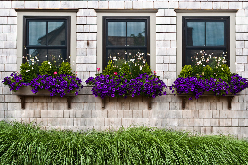 This is an example of a mid-sized traditional landscaping in Other.